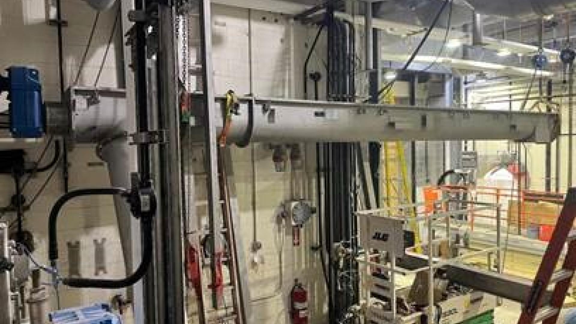 End of screw conveyor where material will be discharged