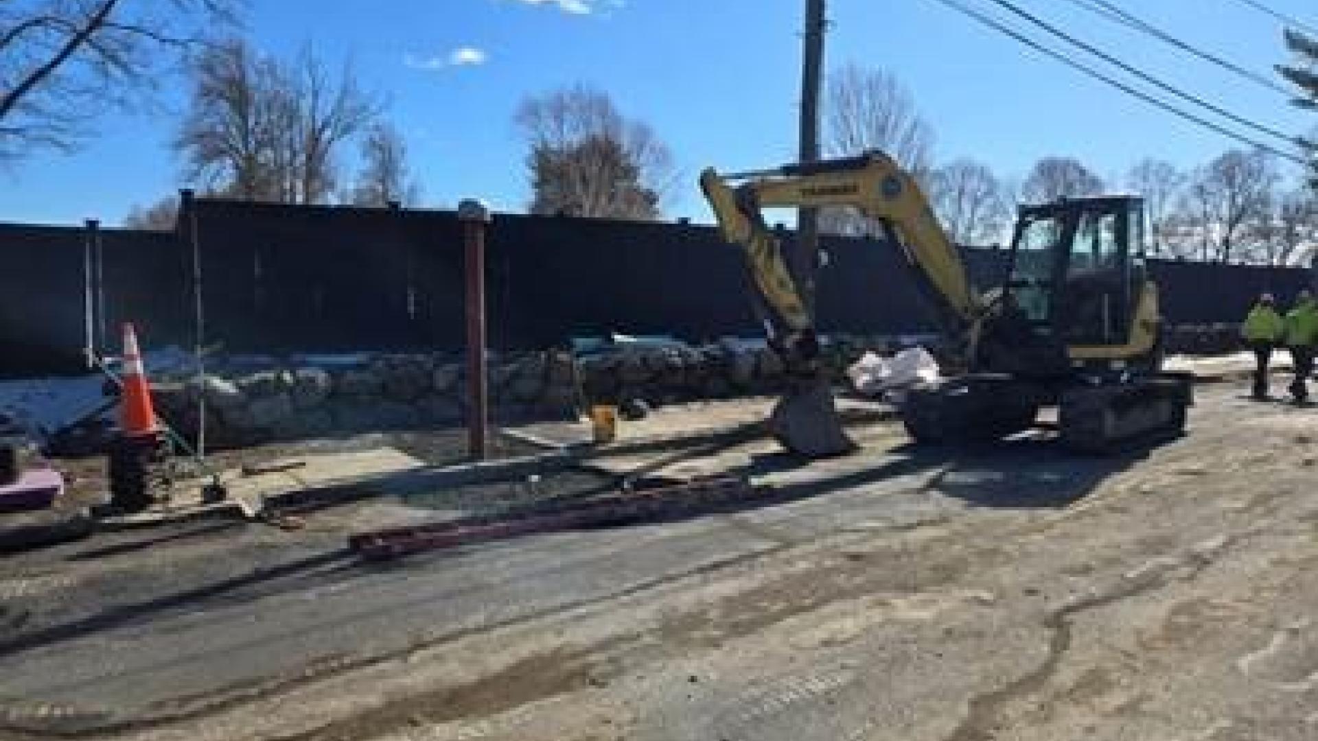 Installing air release valve on Common Street in Watertown