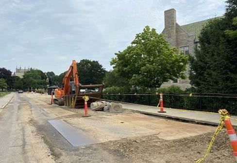 A previous access pit gets filled in and smoothed over. 