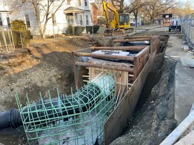 36-inch butterfly valve and blow off piping installed and thrust blocks being formed