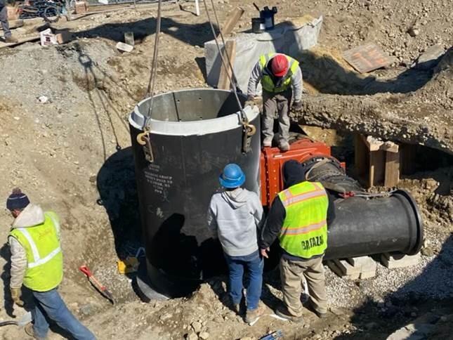 Blow off manhole being set in place